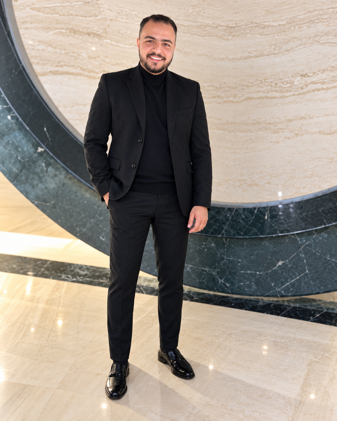 Mostafa Mohamed Amin wearing a black suit